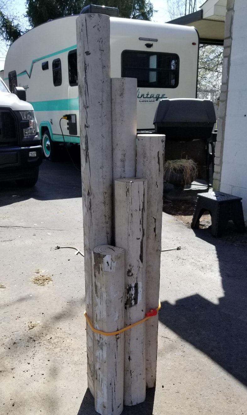 five random sizes of landscape timbers upright