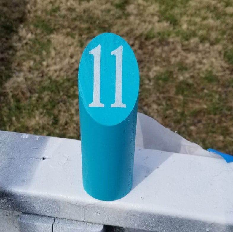 number 11 stenciled on molkky pin