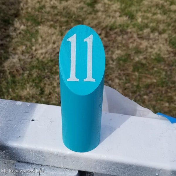 number stenciled on molkky pin with spray paint