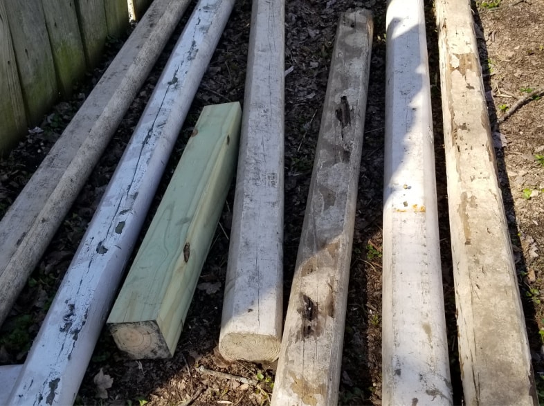 a pile of 7 reclaimed landscape timbers