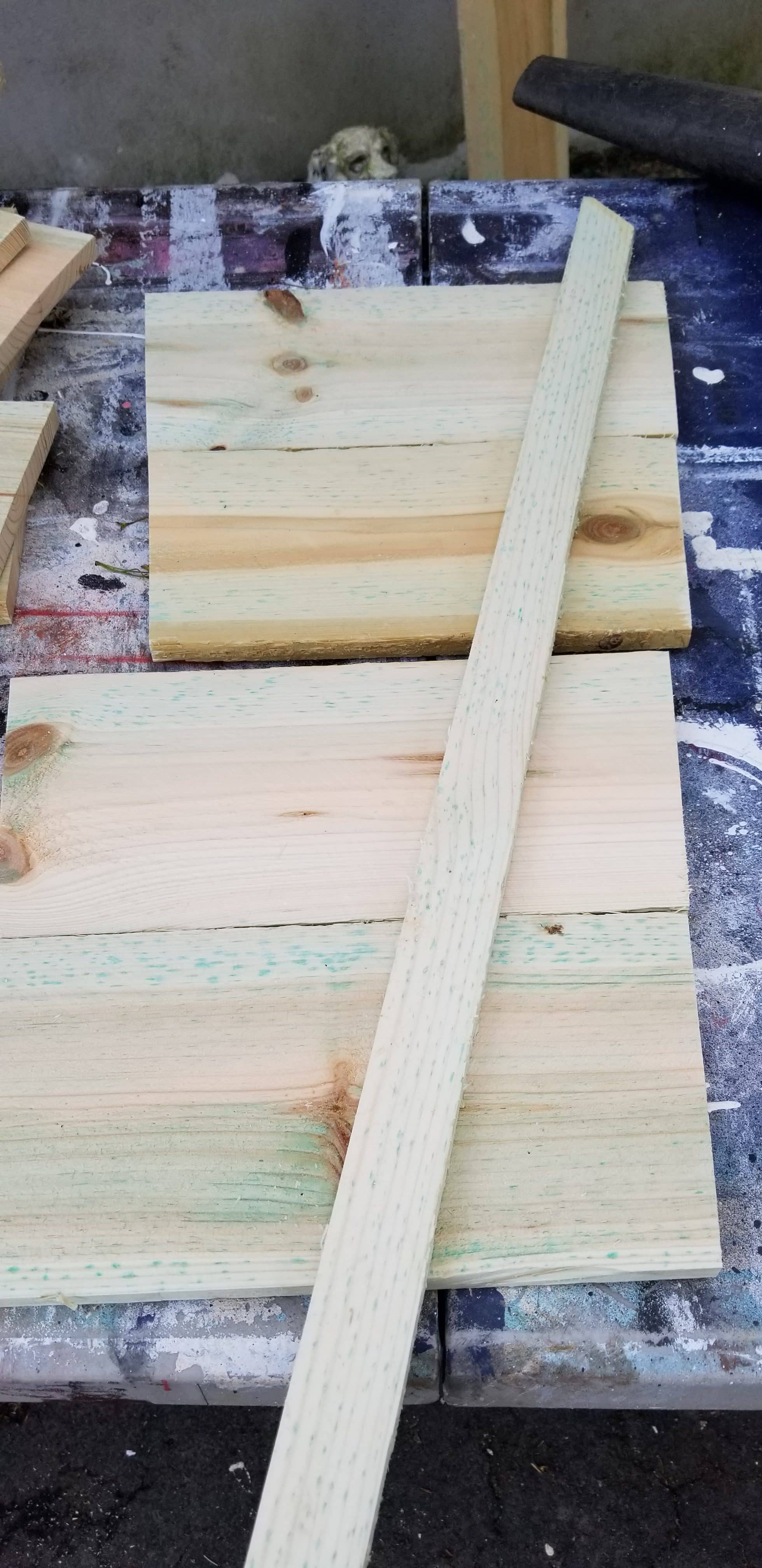 long narrow board laying on smaller boards