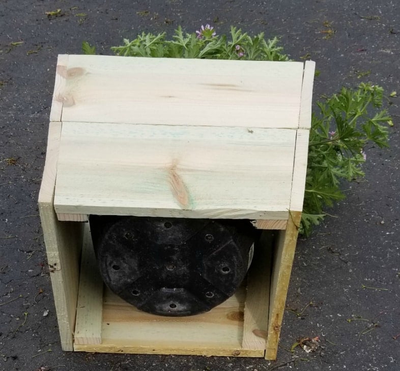 plastic flower pot cover made out of wood without a bottom
