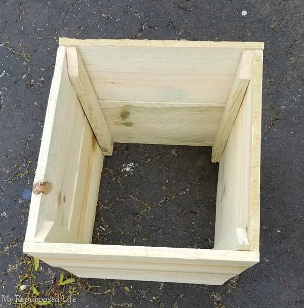 simple wooden planter to cover up ugly plastic flower pot