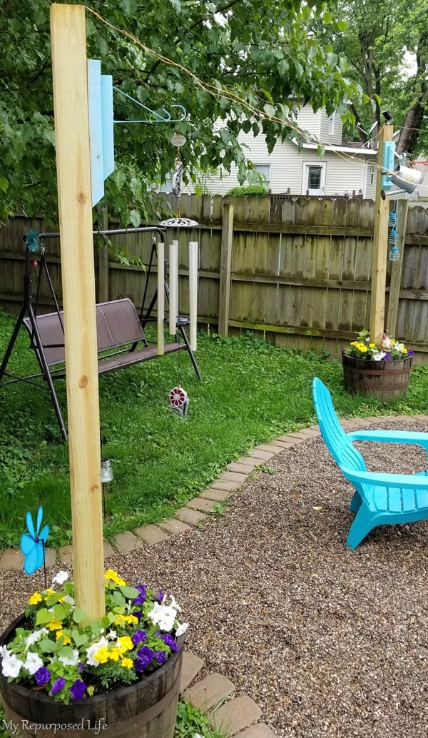 diy wooden brackets to hang wind chimes on 4x4 whiskey barrel planter 4x4 post