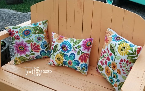 pretty pallet bench with floral pillows MyRepurposedLife