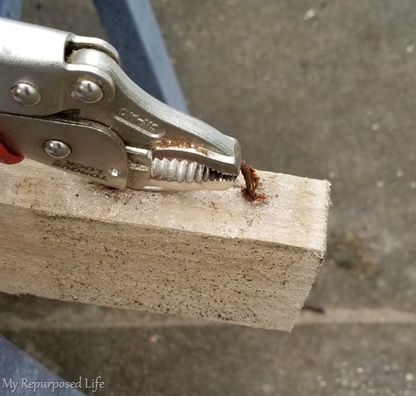 pry pallet nail from stringer with vice grips