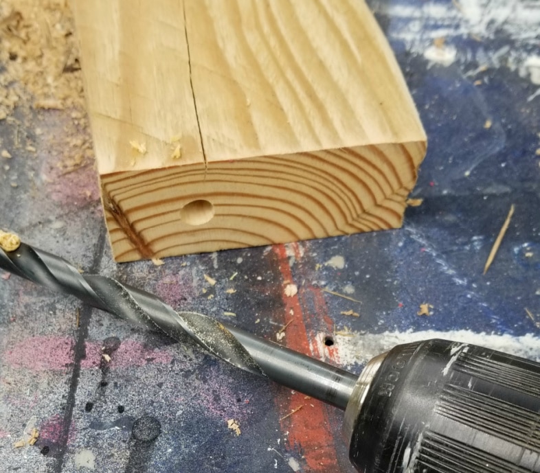 drill 2 holes in bottom of 2x4