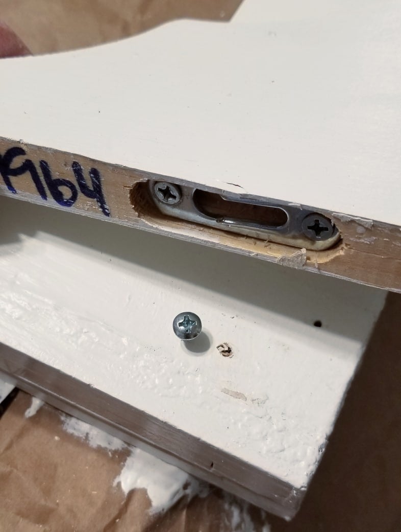 installing wooden brackets on window