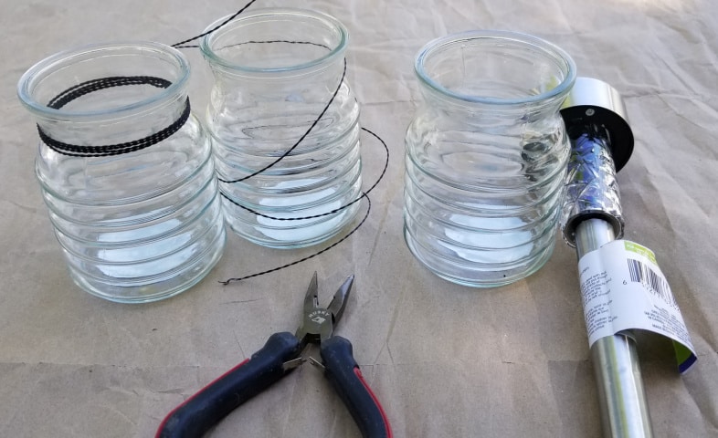 jars and snippers to mak easy two dollar hanging solar lights