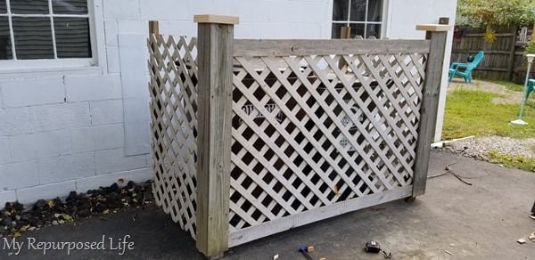 adding finishing touches to garbage can corral