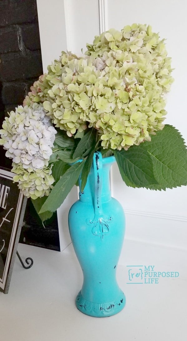 An over sized thrift store vase gets a much needed makeover. This is sort of a makeover of a makeover because someone had already painted over the original paint! #MyRepurposedLife #thrift #store #makeover #spraypaint #easy #thriftstoredecorteam via @repurposedlife