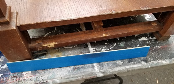 use blue tape on scrap wood to mend broken veneer