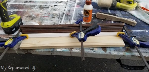 clamps and gorilla wood glue secure small trim