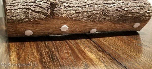 add felt dots to bottom of log