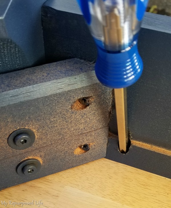 reattach table to base with screwdriver