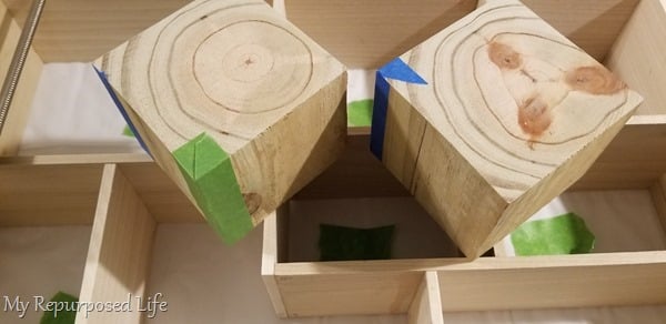 tape corners of wooden blocks