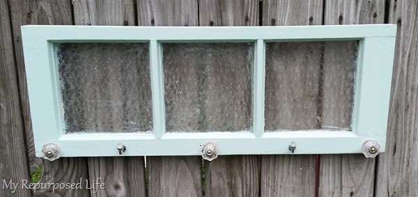 vintage green window used for hanging items