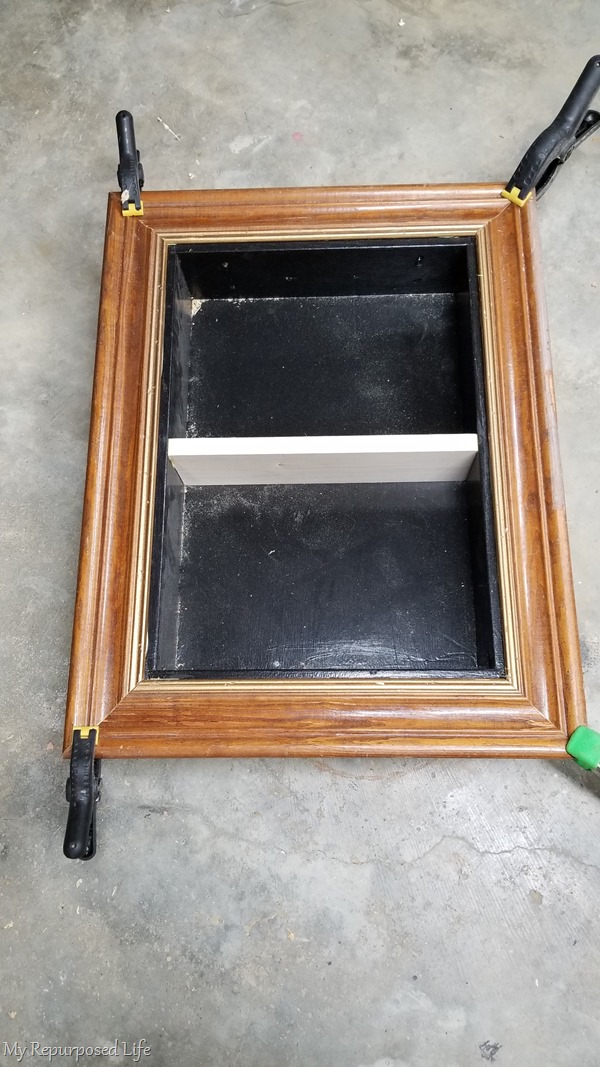 glue and clamp frame around shadow box