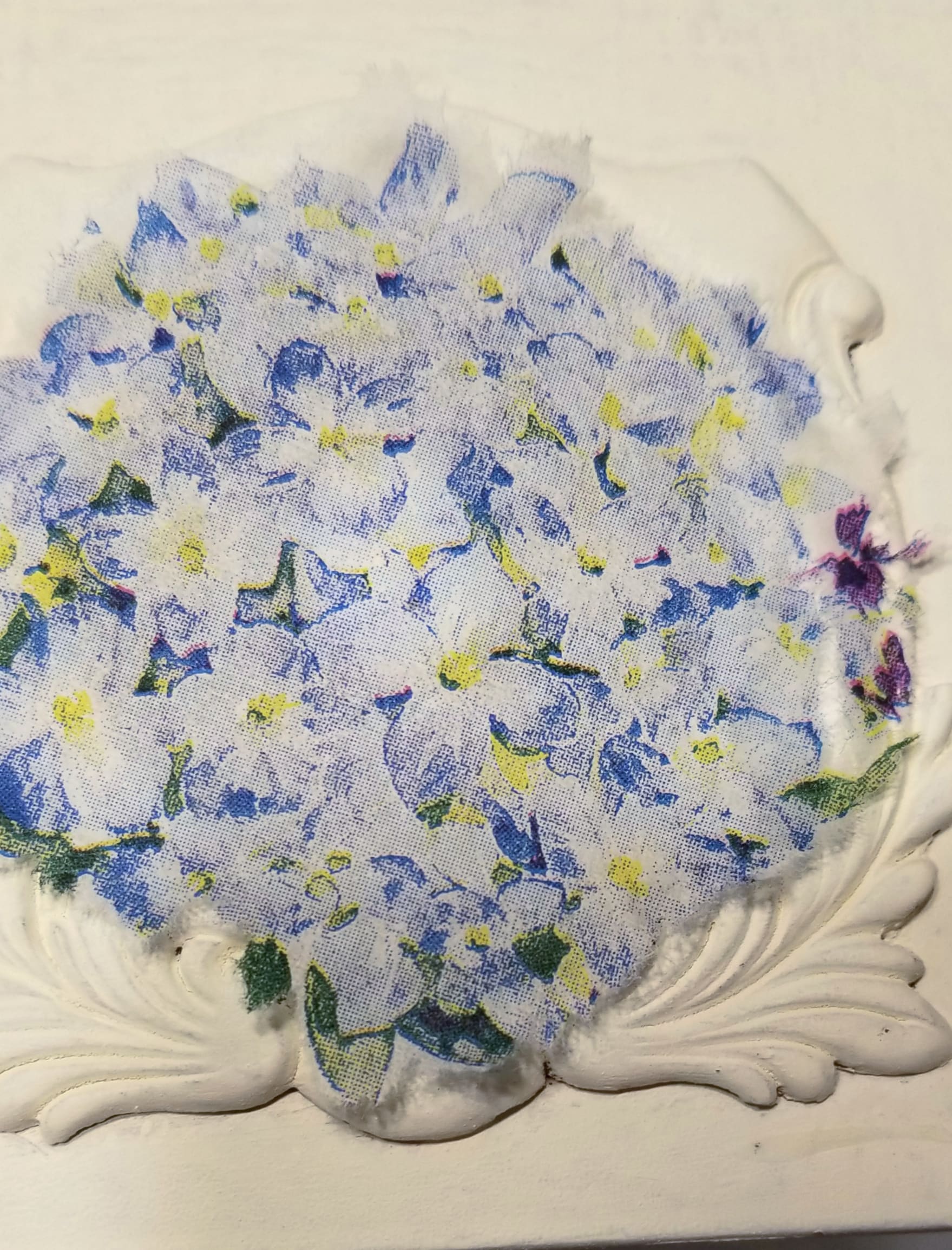 napkin laying over ornate sewing drawer