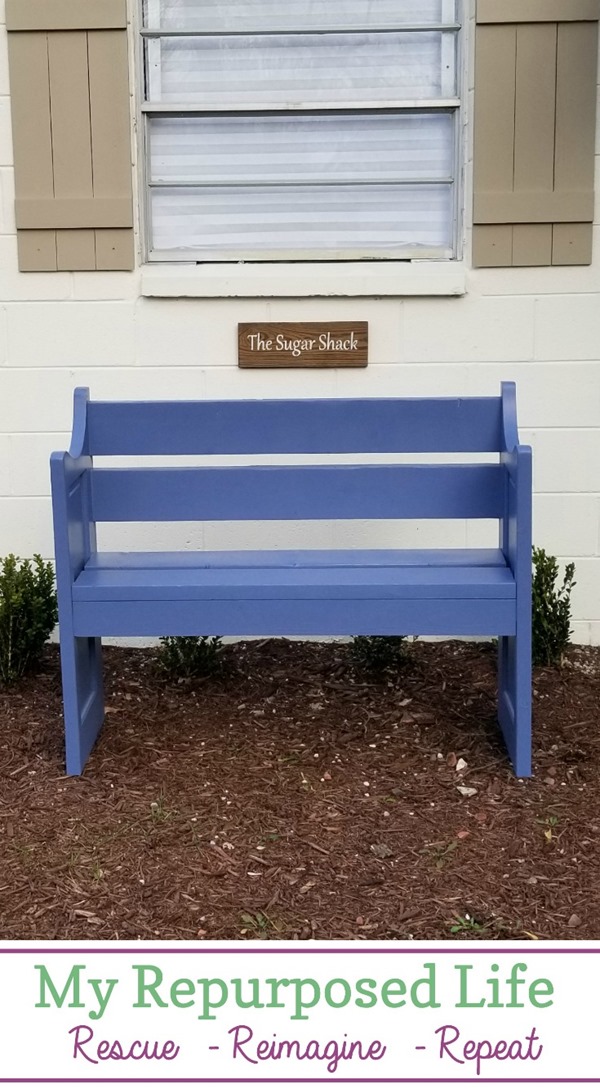 small blue bench made from a door and reclaimed lumber MyRepurposedLife