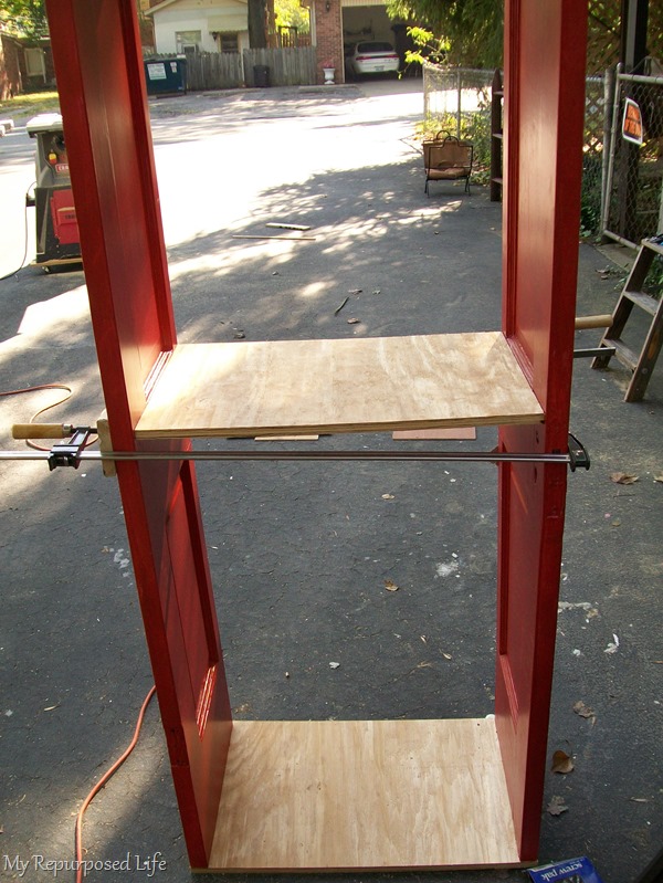 assembling a repurposed door bookshelf