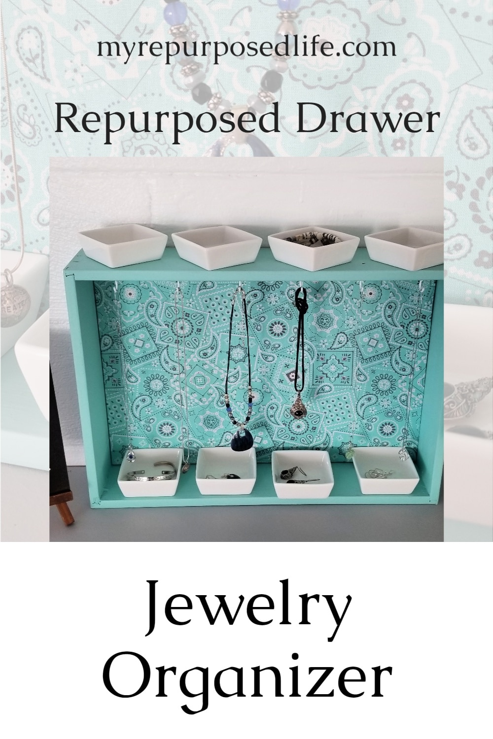 How to make your own repurposed drawer jewelry organizer. I used an old drawer, but you could easily customize this project by making a box out of 1x4's. This jewelry organizer can hang on the wall or rest on a dresser. The small white dishes are perfect for holding smaller items such as earrings or bracelets. #MyRepurposedLife #repurposed #furniture #drawer #jewelry #organizer #diy #project via @repurposedlife