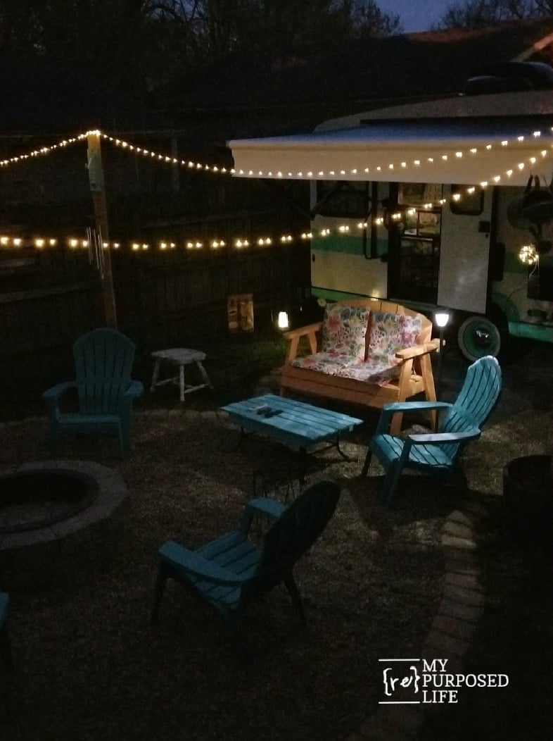 camper and solar lights in a backyare