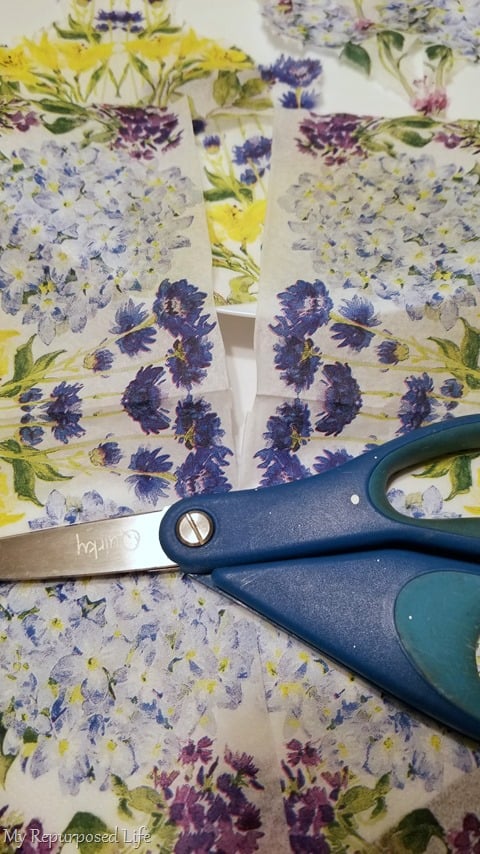 cut napkin in half with scissors