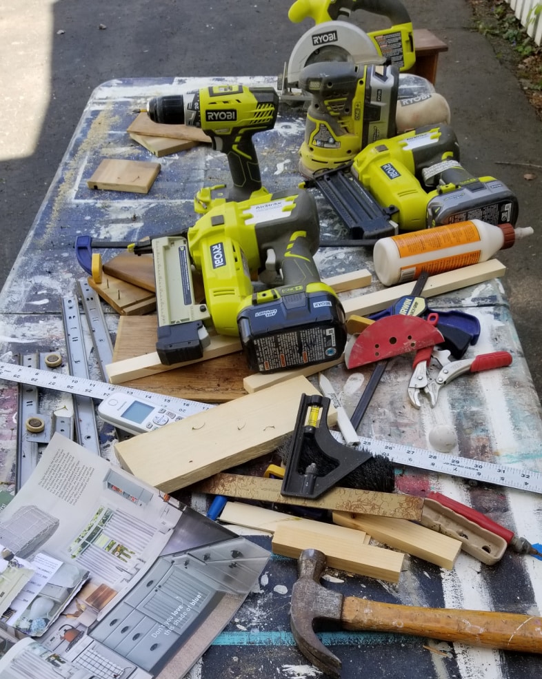 messy work table of ryobi tools
