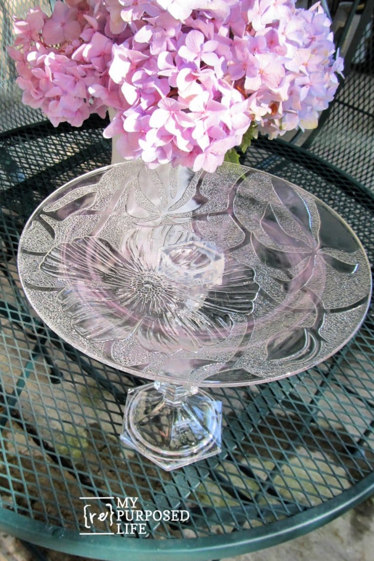 a clear plate stacked on a candle holer