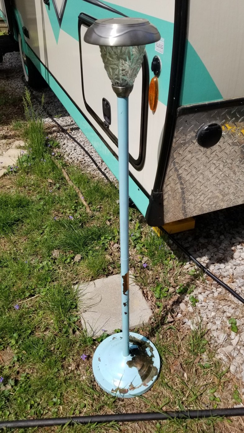outdoor lamp with peeling turquoise paint