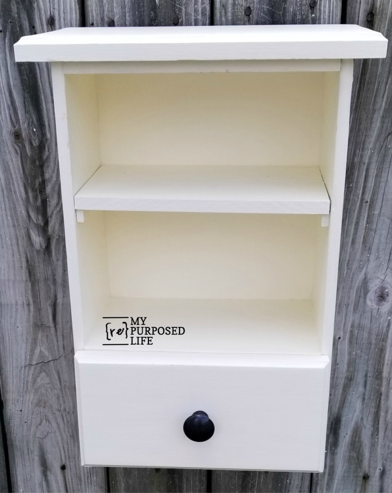 white wall cabinet made from repurposed drawers MyRepurposedLife