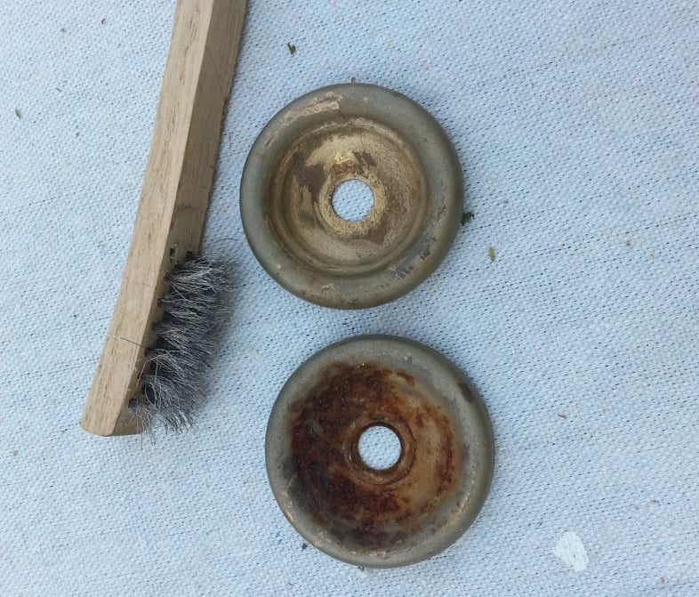 wire brush and rusty lamp parts