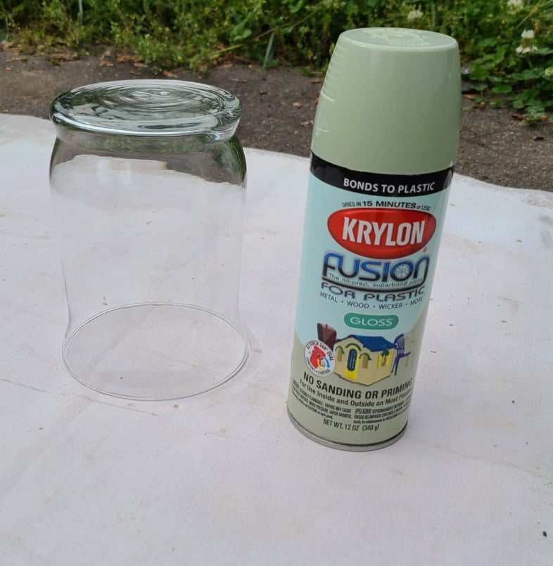 spray painting a vase green