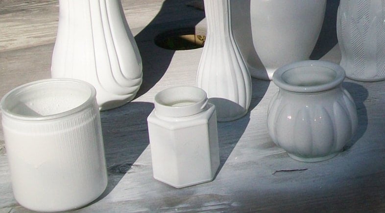 spray painting inside a glass vase or jar