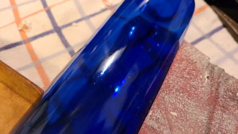 sand sticky residue off wine bottle