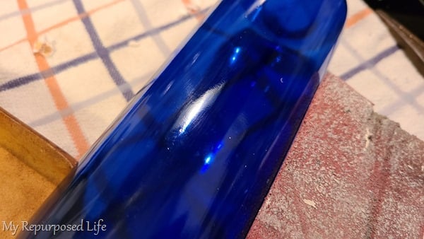 sand sticky residue off wine bottle