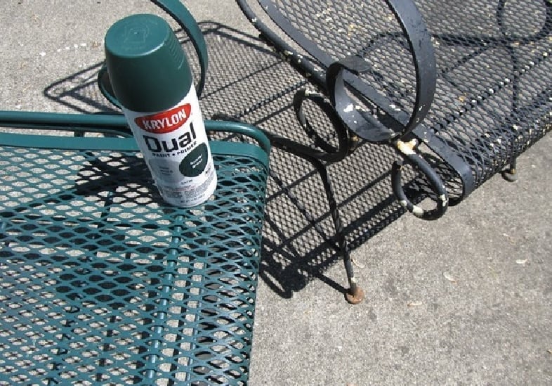 two metal chairs, one newly spray painted with krylon spray paint