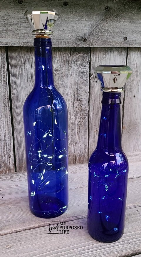 wine bottle solar lights next to a beer bottle MyRepurposedLife