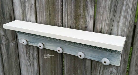 wall shelf with hooks made from a cabinet door