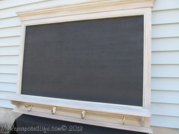 wall shelf with hooks and large chalkboard