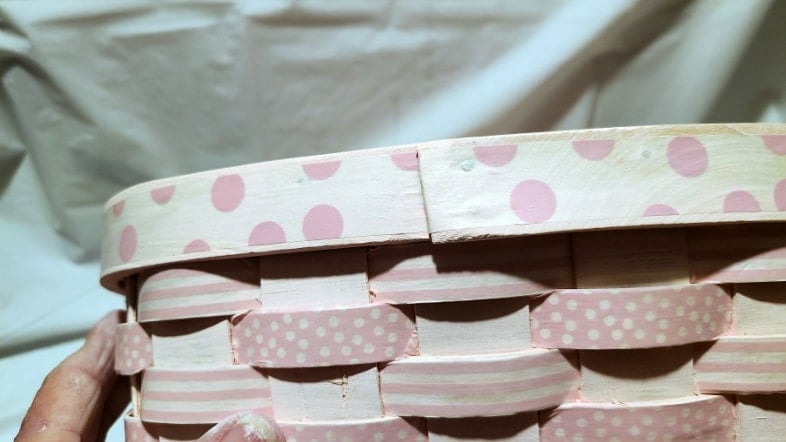 add wide washi tape to top band of basket from the back