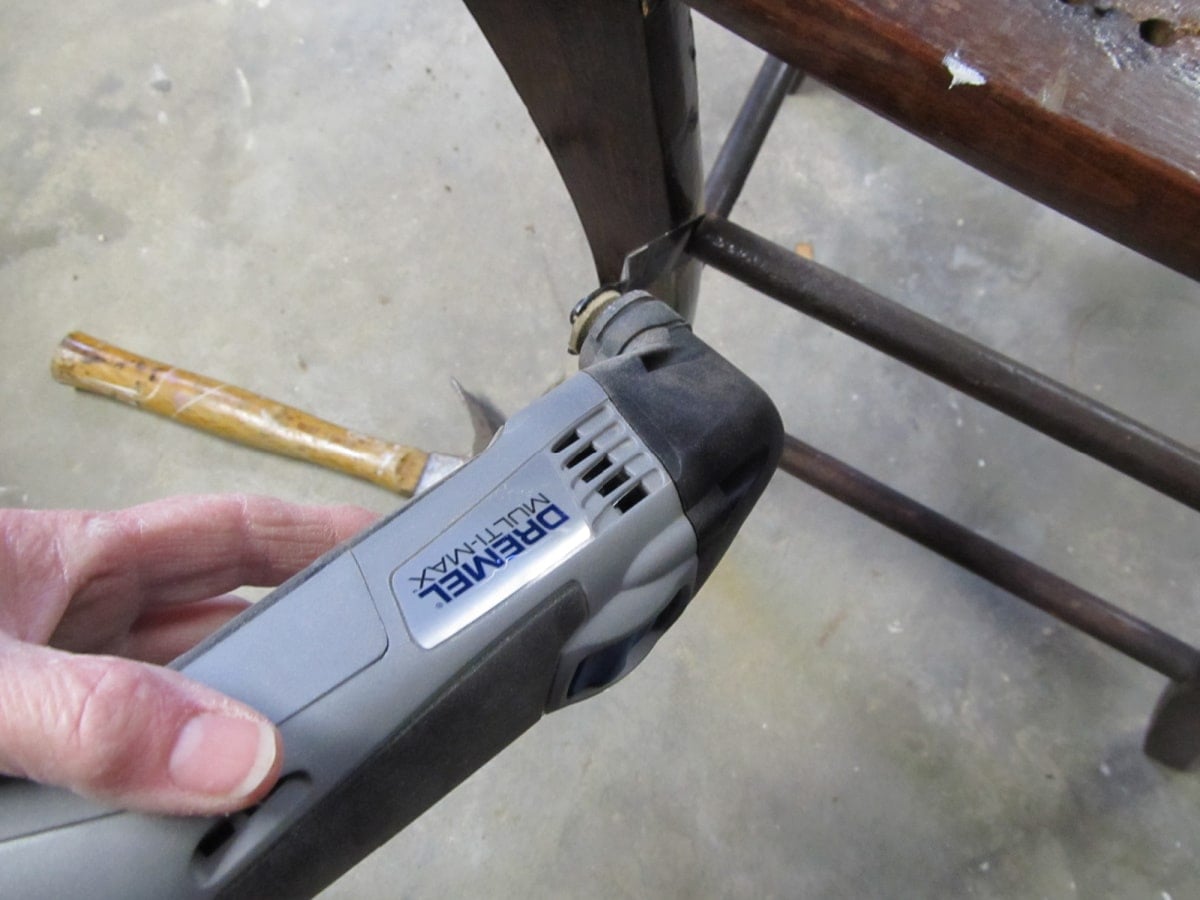 dismantling a chair with a dremel