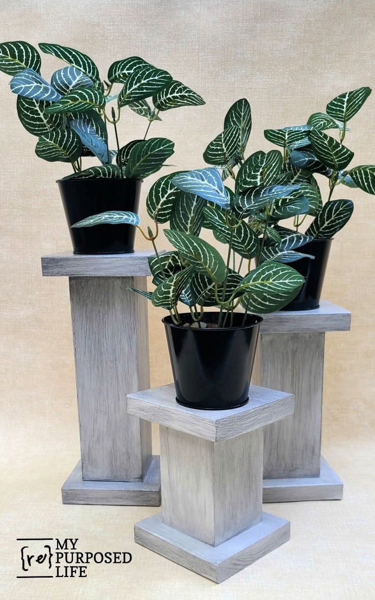 glazed chunky 4x4 plant pedestals with greenery in pots