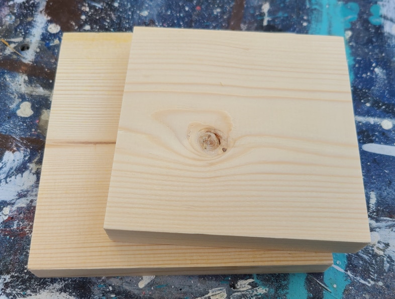 two ssquare pieces of wood stacked on top of each other