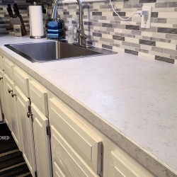peel and stick backsplash and painted countertops
