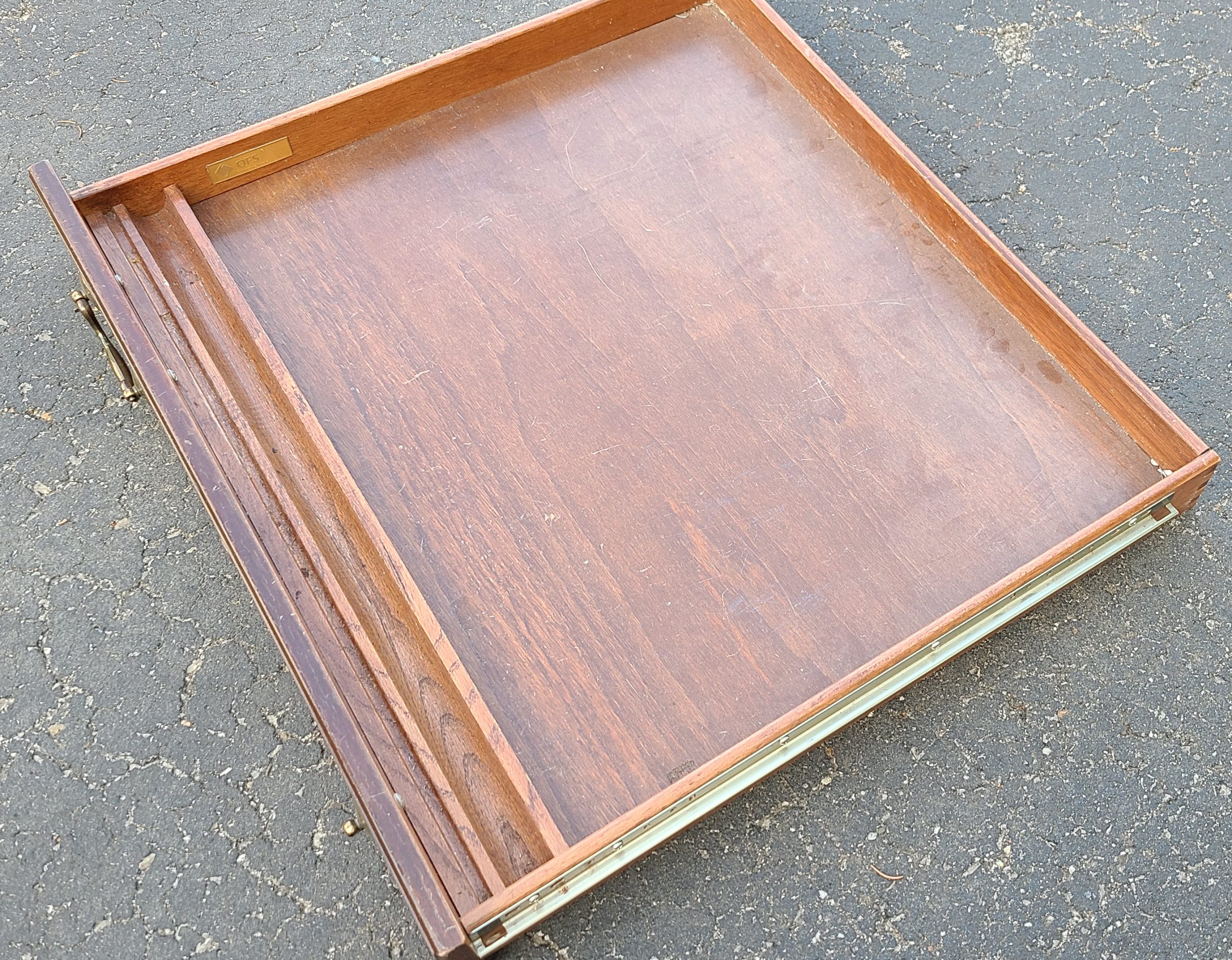 middle desk drawer laying on the driveway