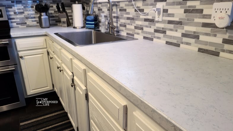 bright kitchen, white cabinets and countertops