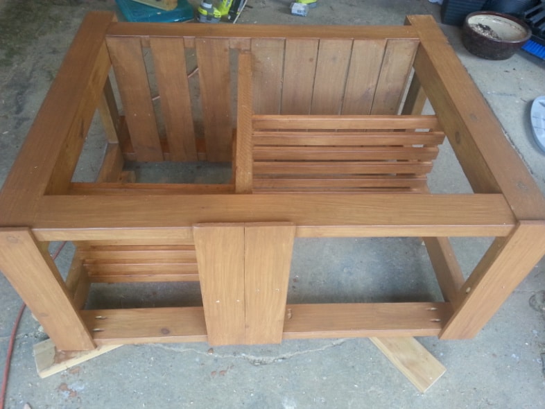 potting table laying on it's back to be stained