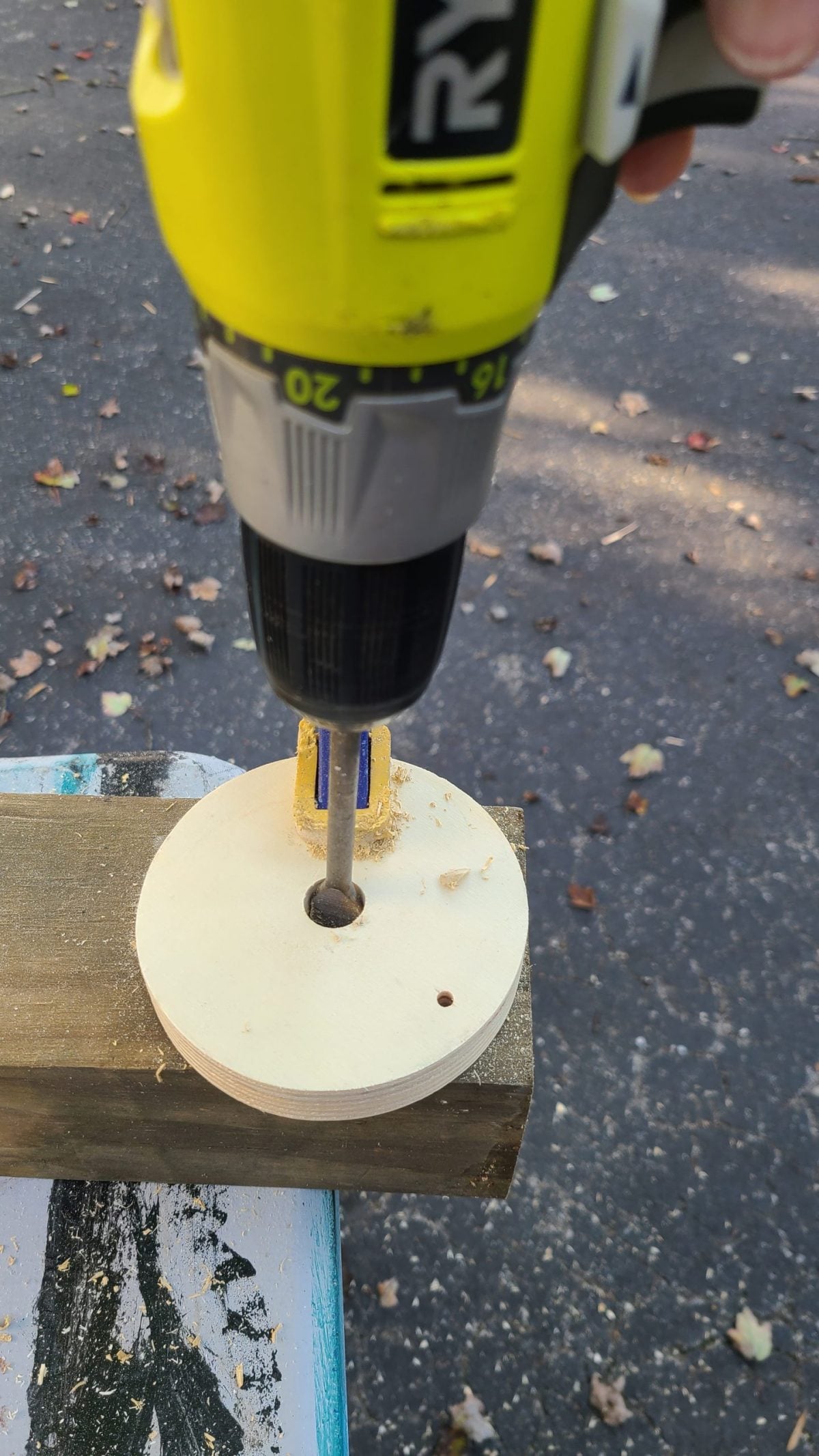 drill a hole in the center of wooden disc